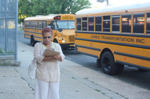 Antoinette Baskerville-Richardson, aschool board member, recrods data on empty buses on the first day of school