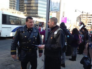 Branden Rippy discusses protest plans with Lt. Robert Sarappa
