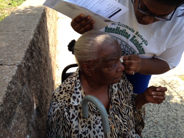 Deseret Segrua, 16,  brushes tears away from the eyes of her grandmother, Deseret Richardson, 83.